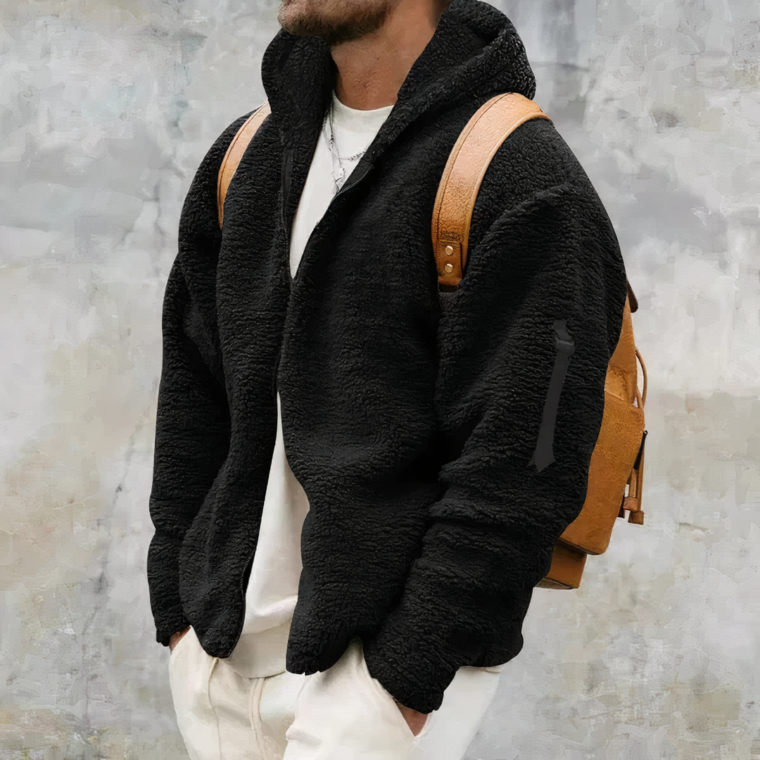 Giacca uomo blu navy in Sherpa con cappuccio e zip, ideale per un outfit invernale casual e alla moda.