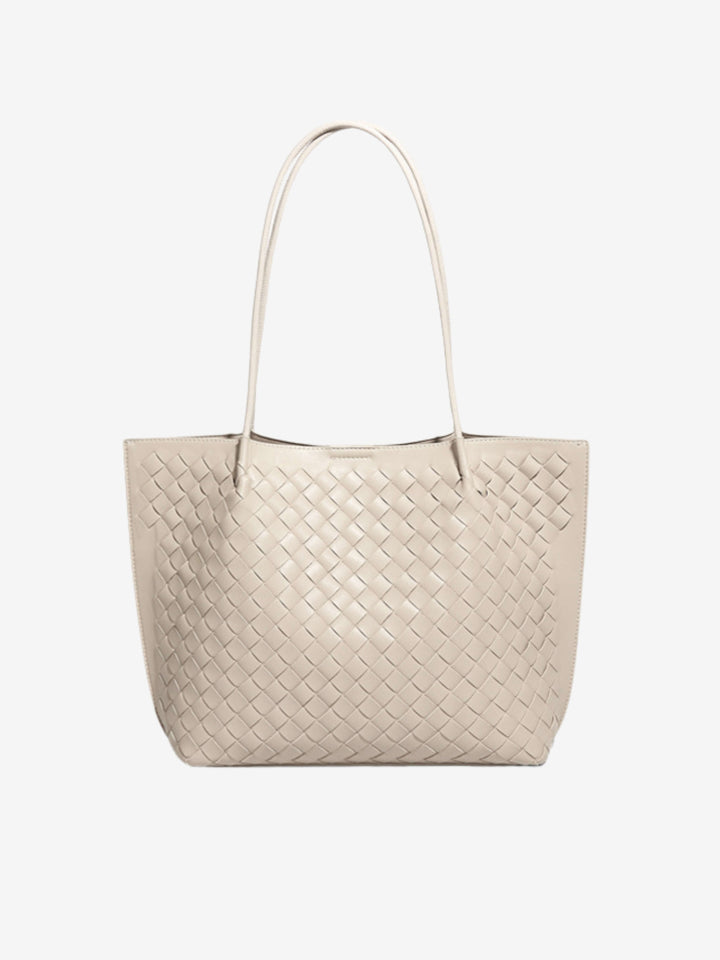 Accessorio essenziale: borsa tote intrecciata da donna, perfetta per stile e praticità quotidiana.