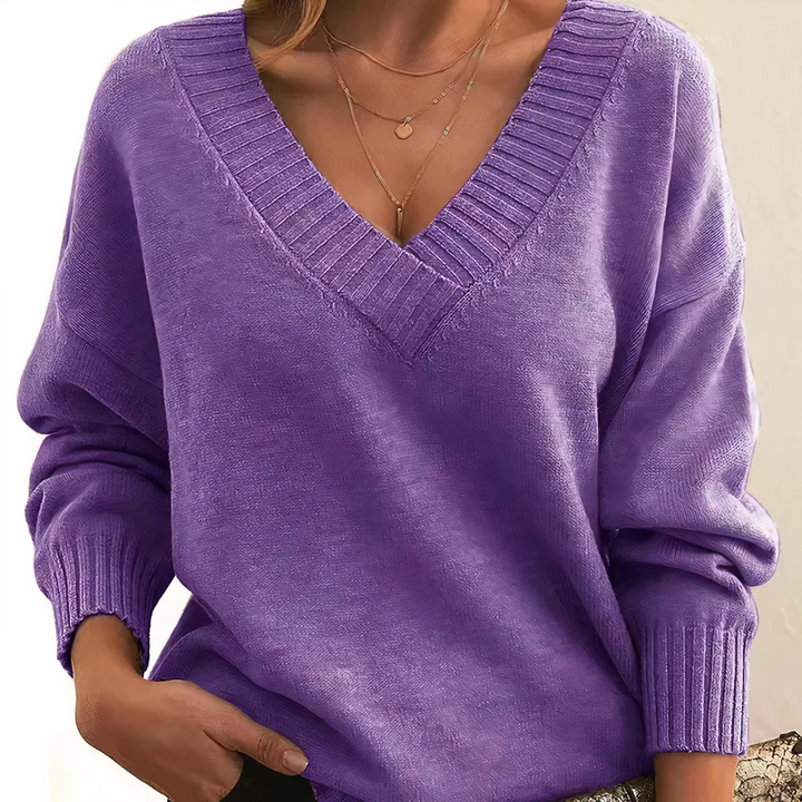Maglione versatile da donna, ideale per outfit autunnali, unisce calore e un tocco di stile moderno.