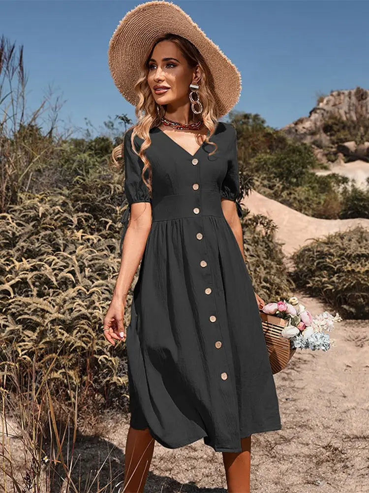 Vestito estivo donna elegante casual con scollatura a V e bottoni. Stile boho chic, ideale per primavera estate.