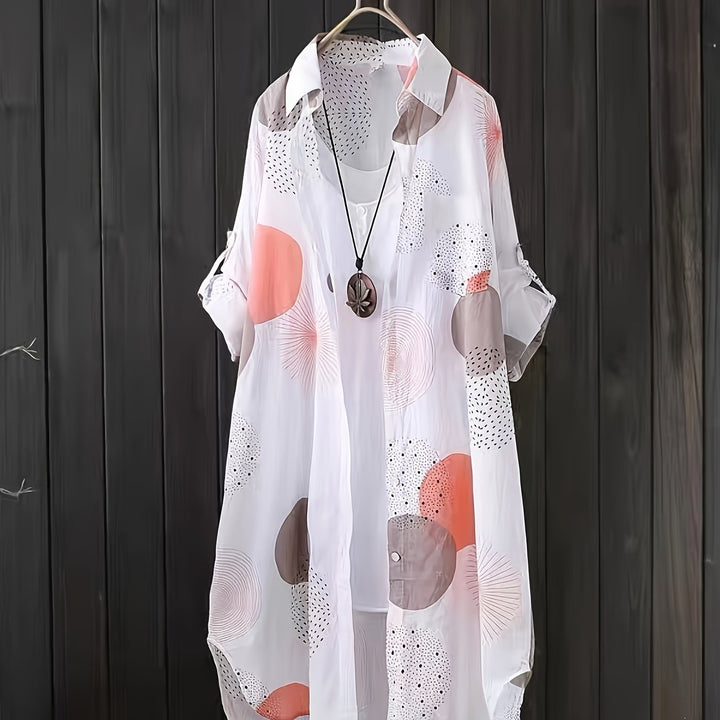Abito estivo femminile a stampa geometrica, morbido e oversize, perfetto per un look casual e confortevole.
