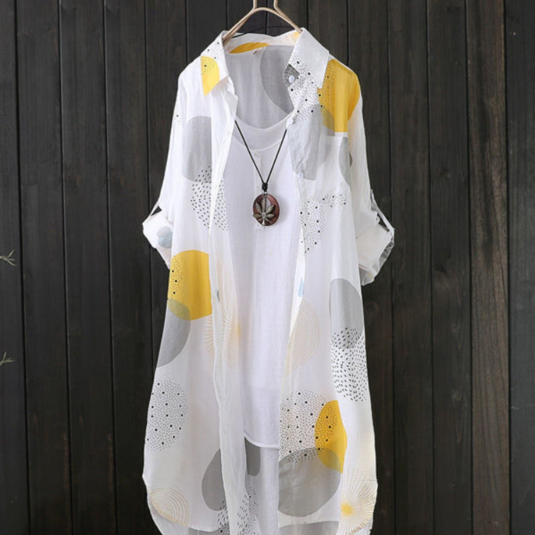 Abito estivo donna fluido con stampa geometrica, vestibilità oversize casual chic, perfetto per primavera/estate.