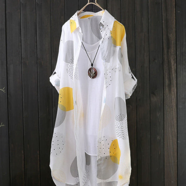 Abito estivo donna fluido con stampa geometrica, vestibilità oversize casual chic, perfetto per primavera/estate.