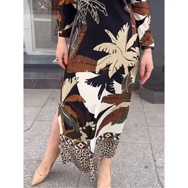 Elegante abito estivo donna nero midi con stampa tropicale e maniche lunghe. Vestito sofisticato con silhouette dritta per la moda.