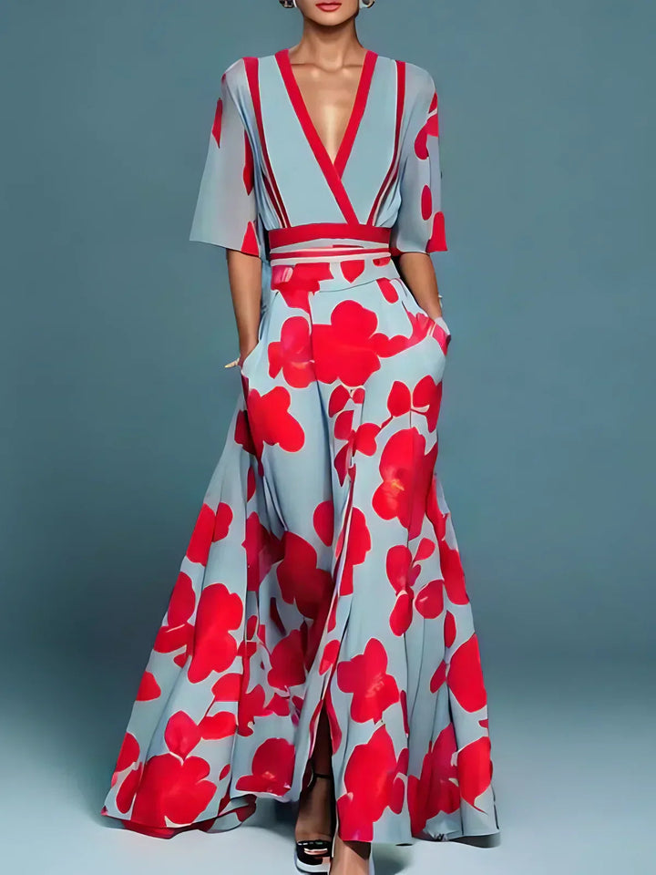 Maxi abito donna floreale vivace con scollo a V e gonna a ruota. Ideale per un look elegante estivo.