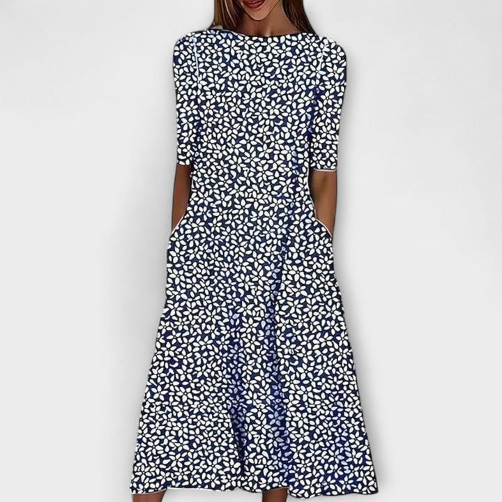 Abito midi donna romantico con fantasia floreale blu e verde. Perfetto per primavera/estate, stile femminile casual chic.