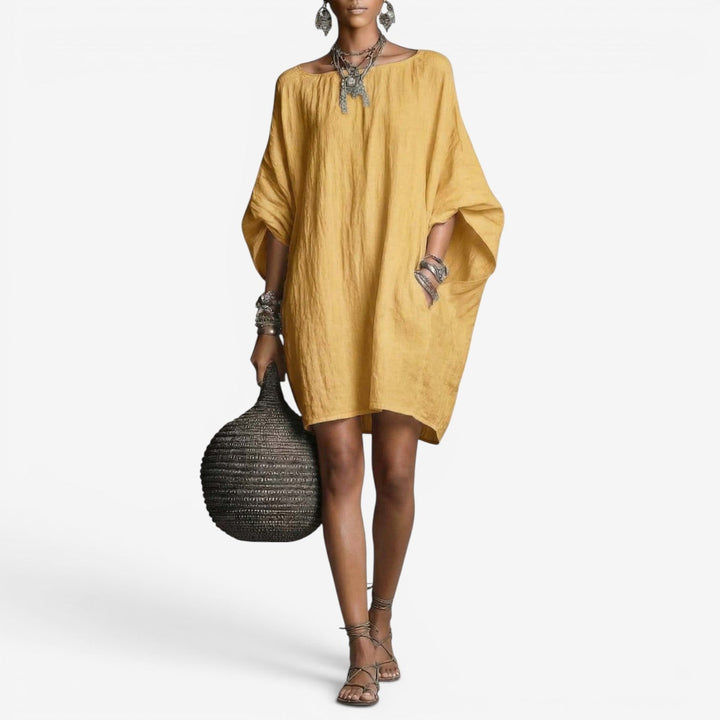 Elegante mini abito donna estivo fluido e oversize, con vestibilità comoda. Perfetto per la primavera estate.