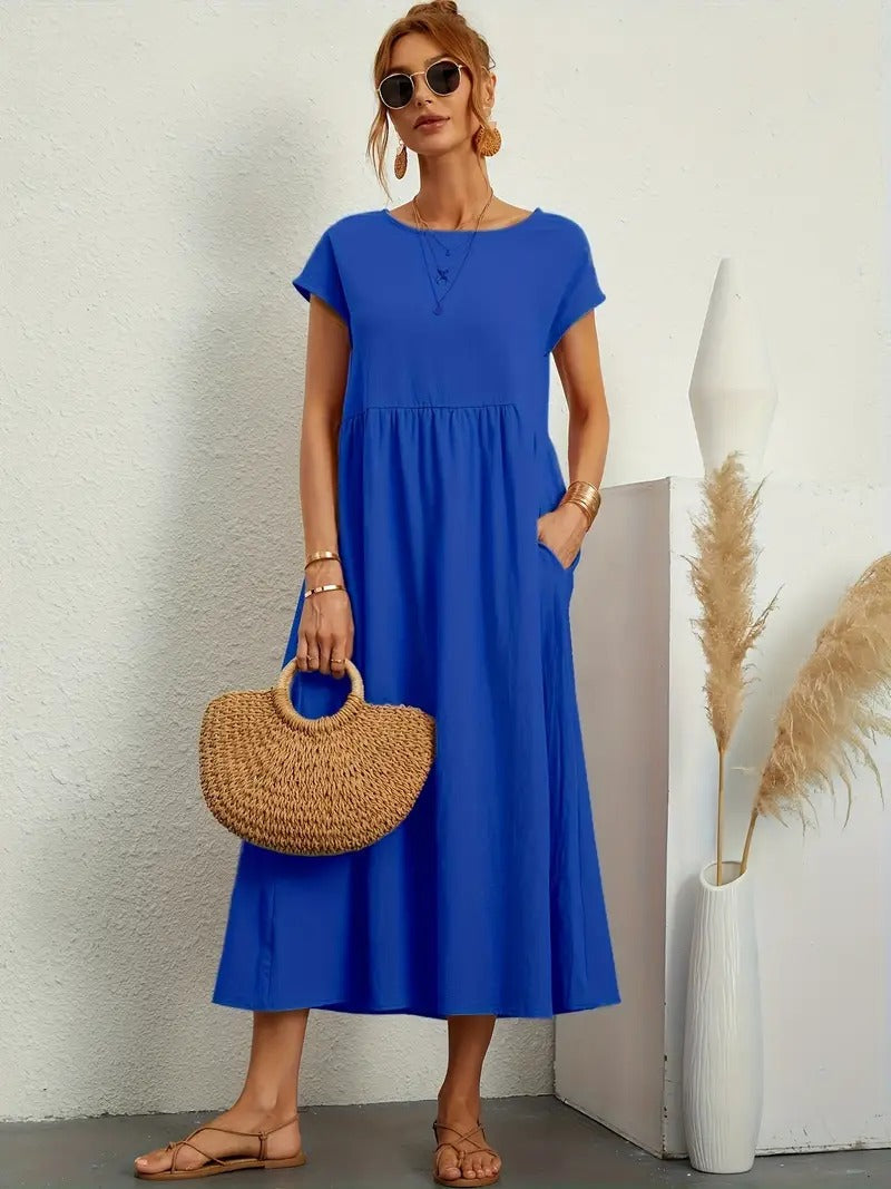 Vestito midi donna versatile e comodo, con tasche funzionali e taglio fluido, perfetto per ogni occasione.