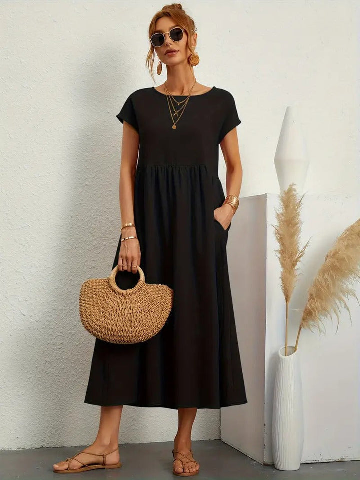 Abito donna fluido e comodo con tasche, vestito midi versatile per look quotidiani pratici.