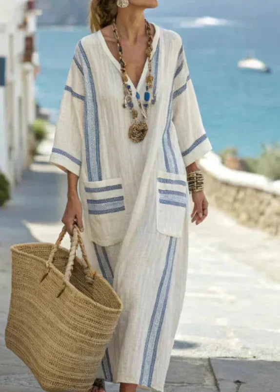 Abito donna estivo, lungo e morbido, con elegante scollo a V. Perfetto per un look casual e alla moda.