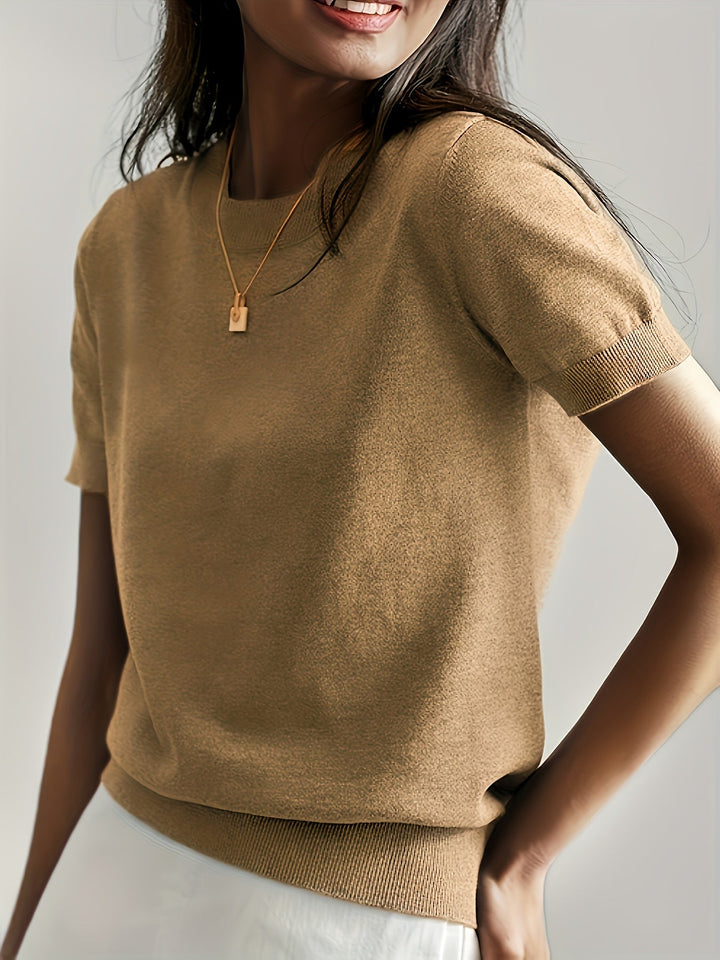 Top donna a maniche corte, design semplice ma raffinato, ideale per comfort.