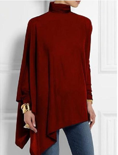 Abbigliamento donna: top alla moda con collo alto asimmetrico e bottoni sulle spalle, per un look distintivo.