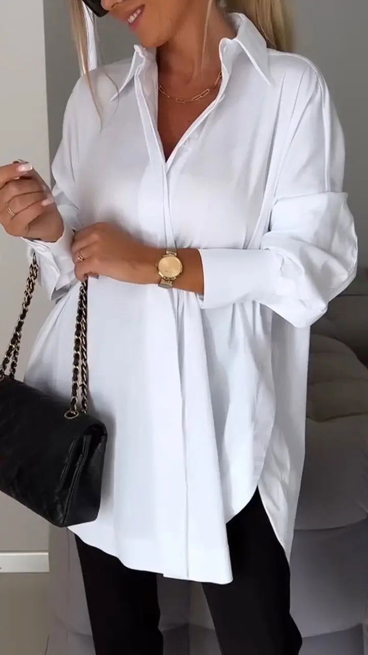 Top donna versatile con vestibilità morbida, maniche lunghe e polsini risvoltati. Ideale per moda casual/ufficio.