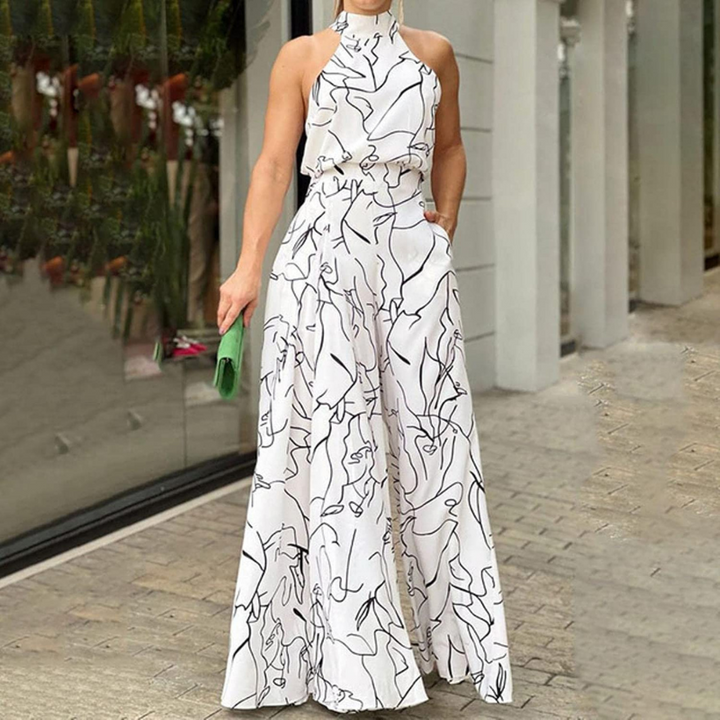 Tuta donna elegante senza maniche con cintura regolabile, perfetta per primavera/estate.