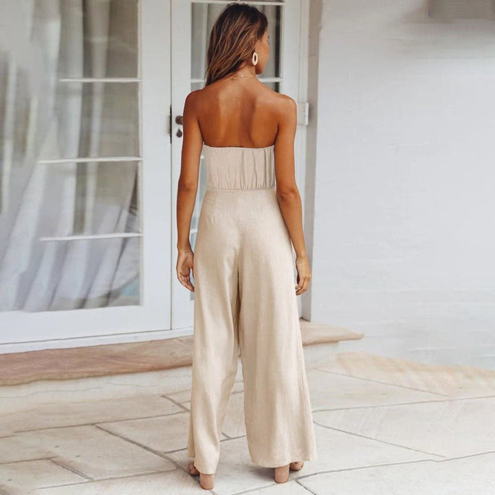 Splendida tuta donna estiva con bustier, design a gamba larga e dettaglio nodo in vita. Crea un look elegante.