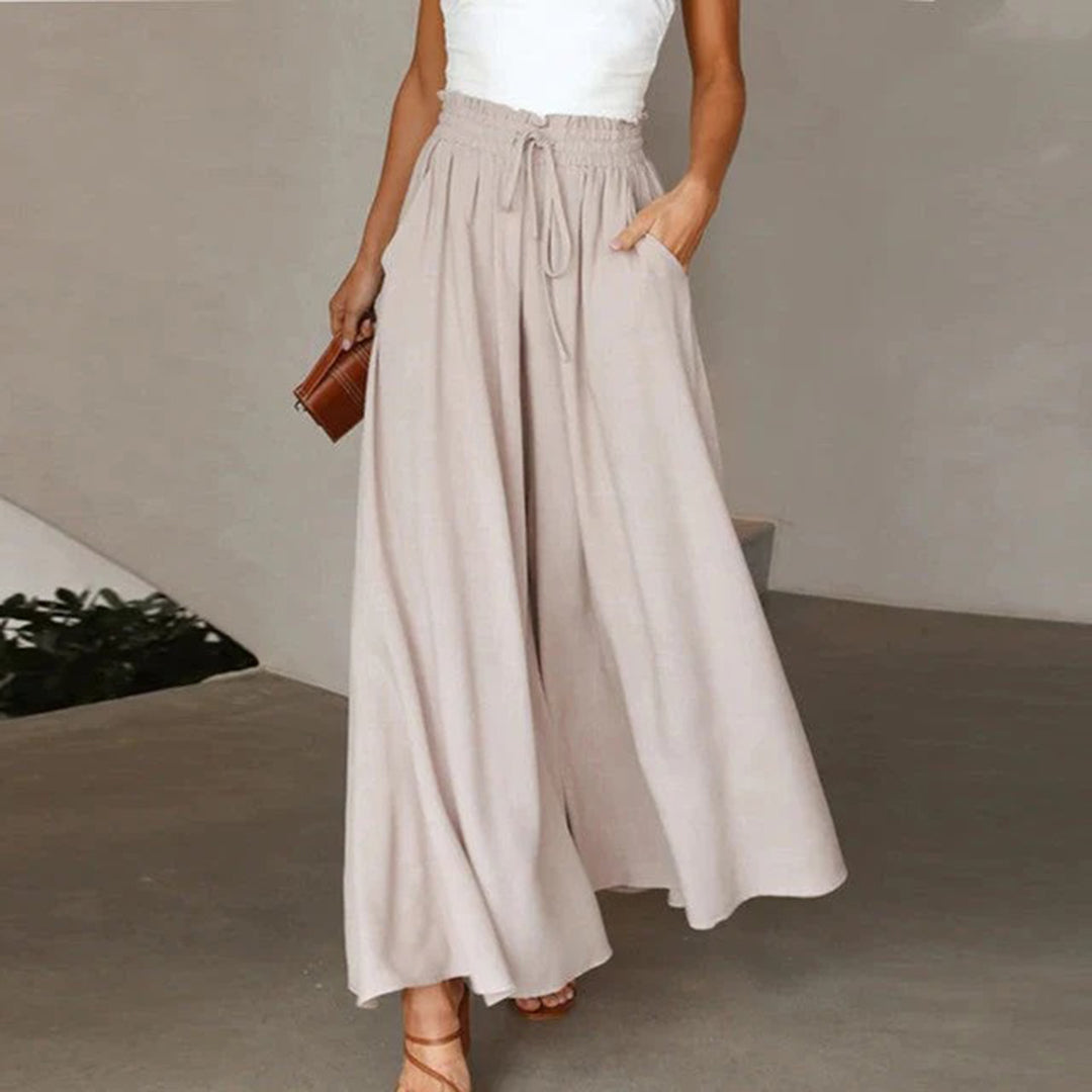 Pantaloni casual palazzo donna a vita alta con coulisse, comodi e fluidi per un outfit rilassato ed elegante.