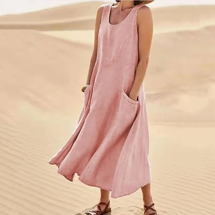 Vestito midi estivo da donna senza maniche, con scollo rotondo e tasche laterali, ideale per look casual e comodi.