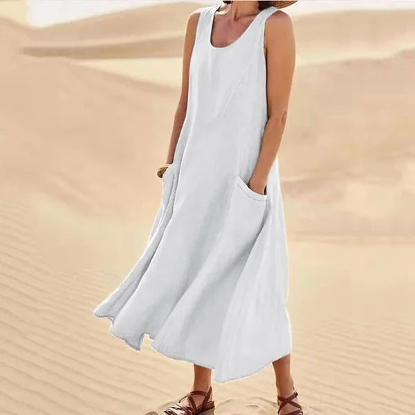 Abito da donna midi estivo, versatile, senza maniche e con tasche, per un comfort primaverile in ogni occasione.