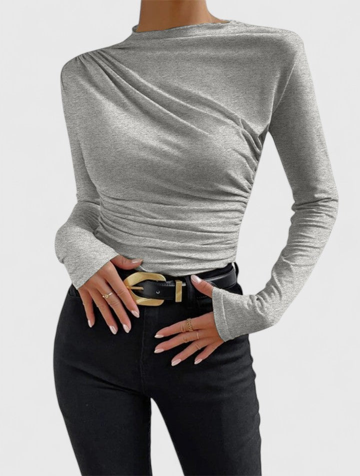 Top donna marrone scuro a maniche lunghe, design plissettato, elegante e comodo per ogni occasione. [[lstfy-media:6]]