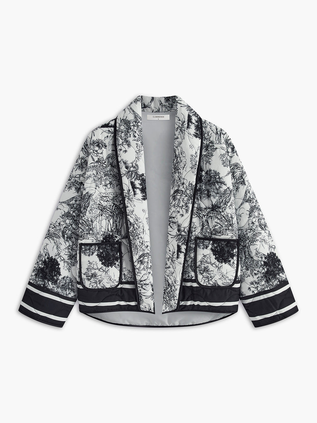 Giacca autunnale donna elegante grigia con stampa artistica, perfetta per un look casual o raffinato.