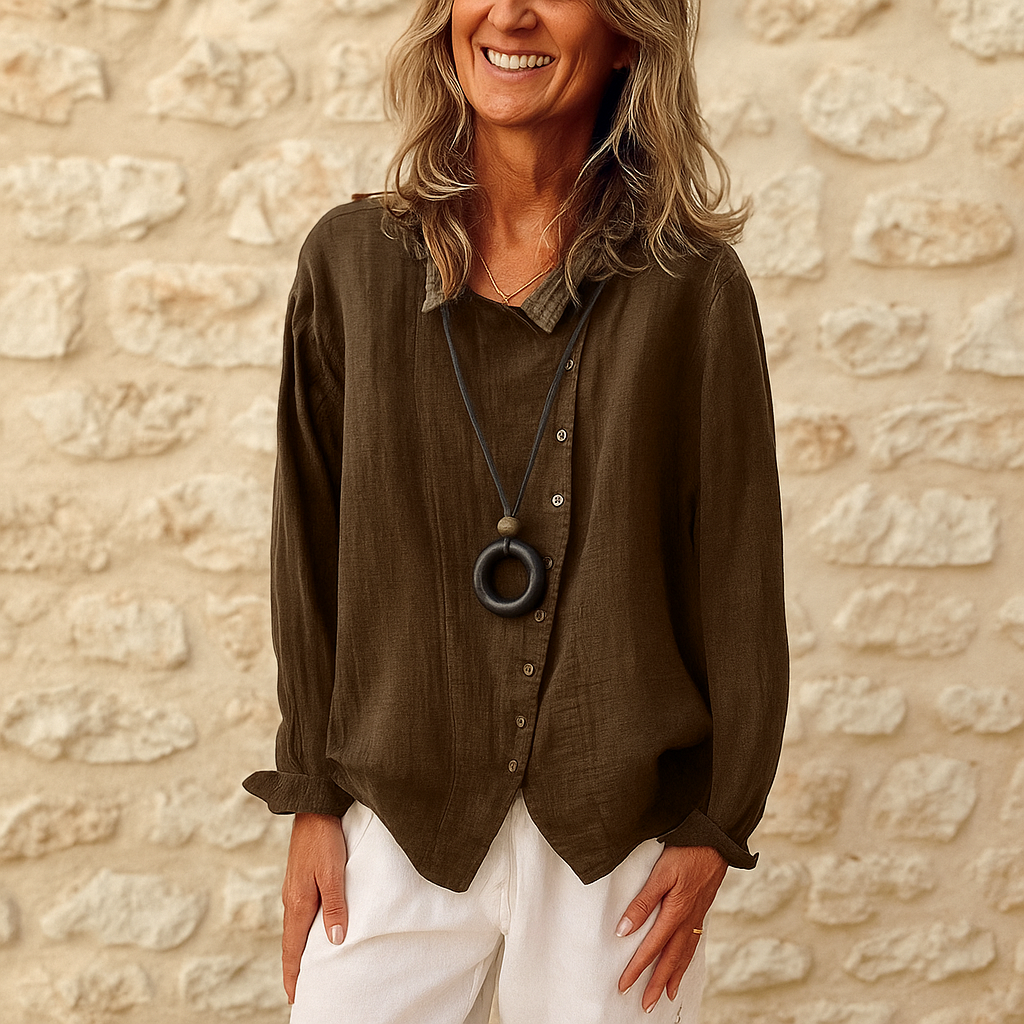 Camicetta elegante donna a maniche lunghe con scollo a V, ideale per look casual o formali. Moda e comfort.