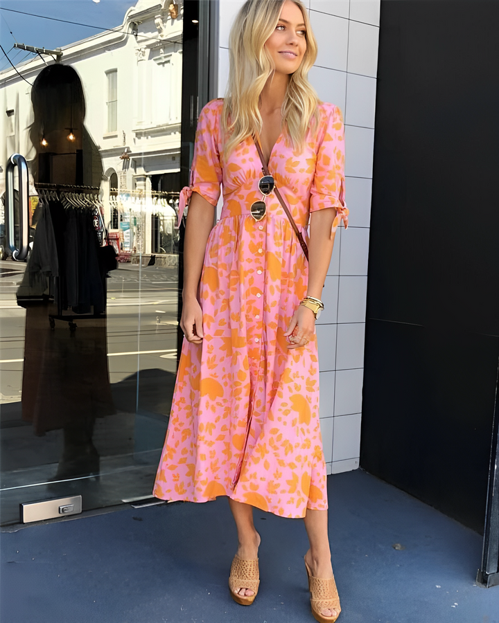 Elegante abito midi floreale da donna con scollo a V, ideale per vacanze, brunch e casual chic estivo.