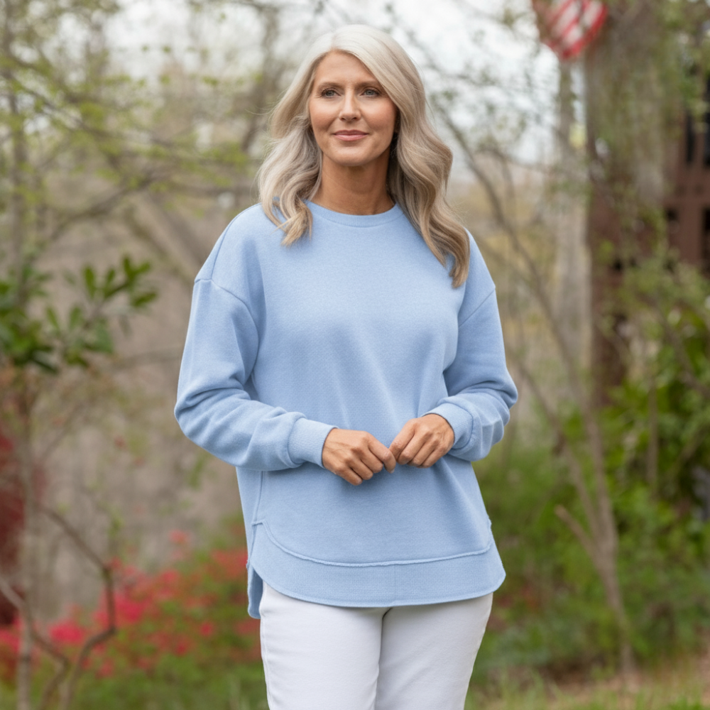 Poncho donna elegante melange con orlo asimmetrico, ideale per outfit casual e stratificati.