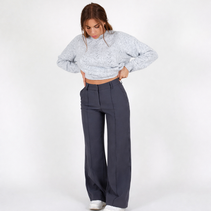 Pantaloni donna con taglio dritto e vita alta, un capo di moda elegante e indispensabile per ogni occasione.