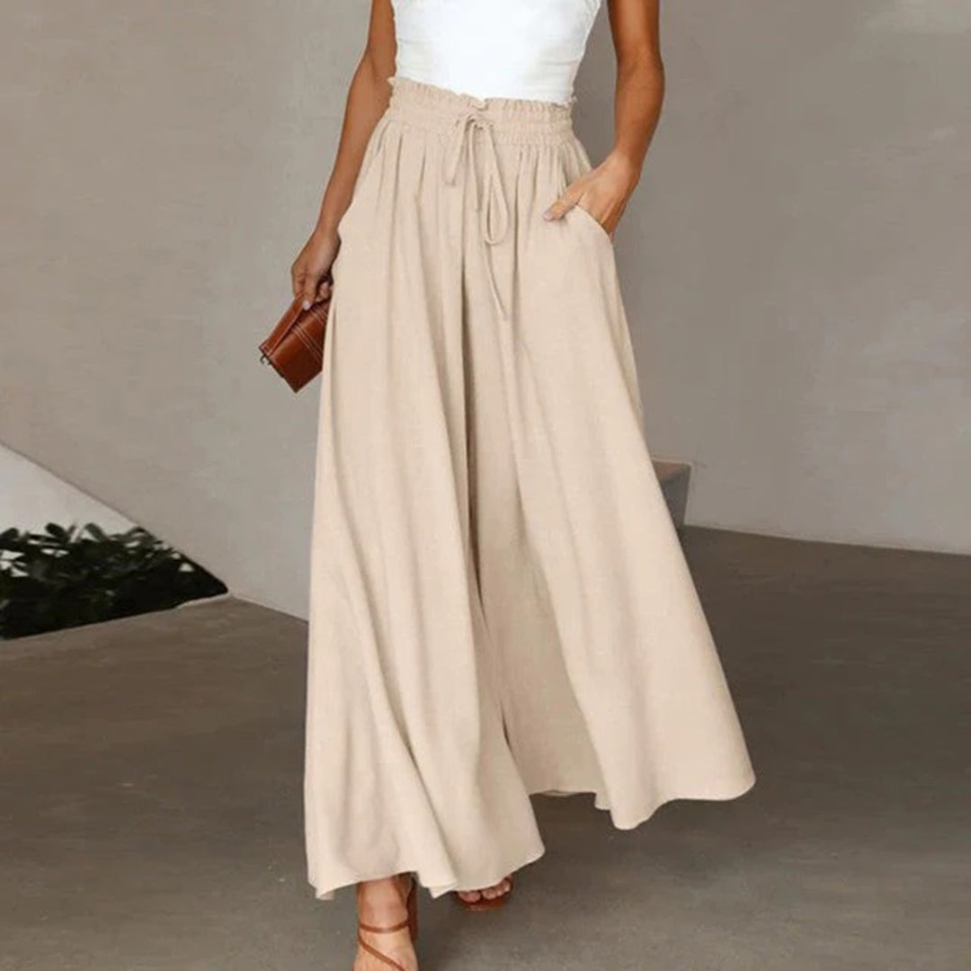 Outfit estivo: pantaloni palazzo donna fluidi, vita alta e coulisse, ideali per comfort e stile chic.