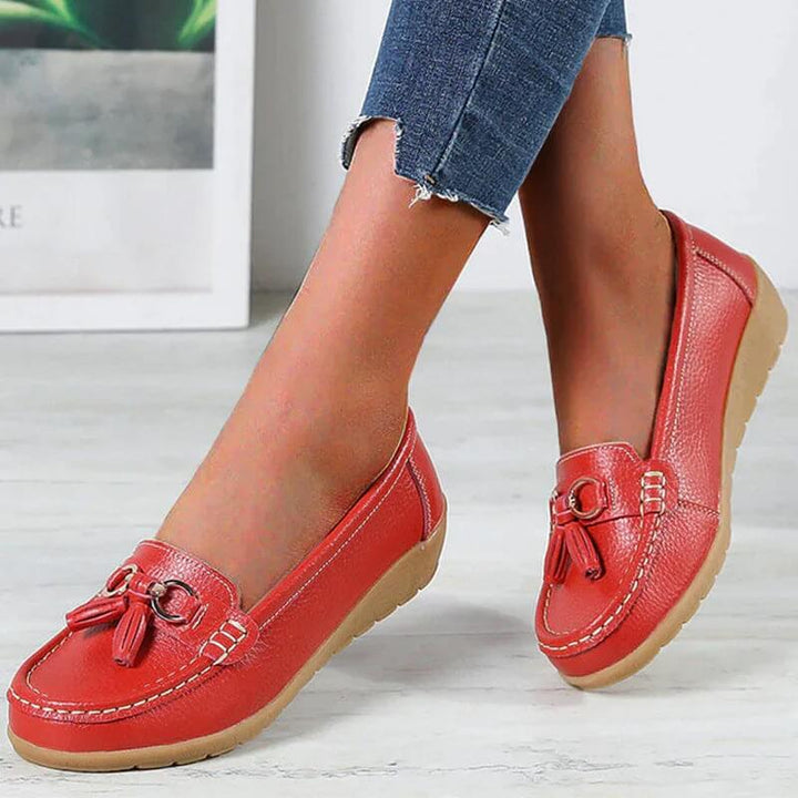 Scarpe donna con fiocco e frange, mocassini piatti in pelle, comodi per il lavoro o il tempo libero.