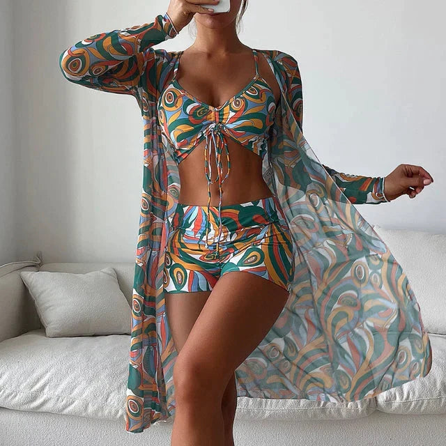 Bikini donna elegante tre pezzi con top, slip e copricostume coordinato. Perfetto per spiaggia e piscina.