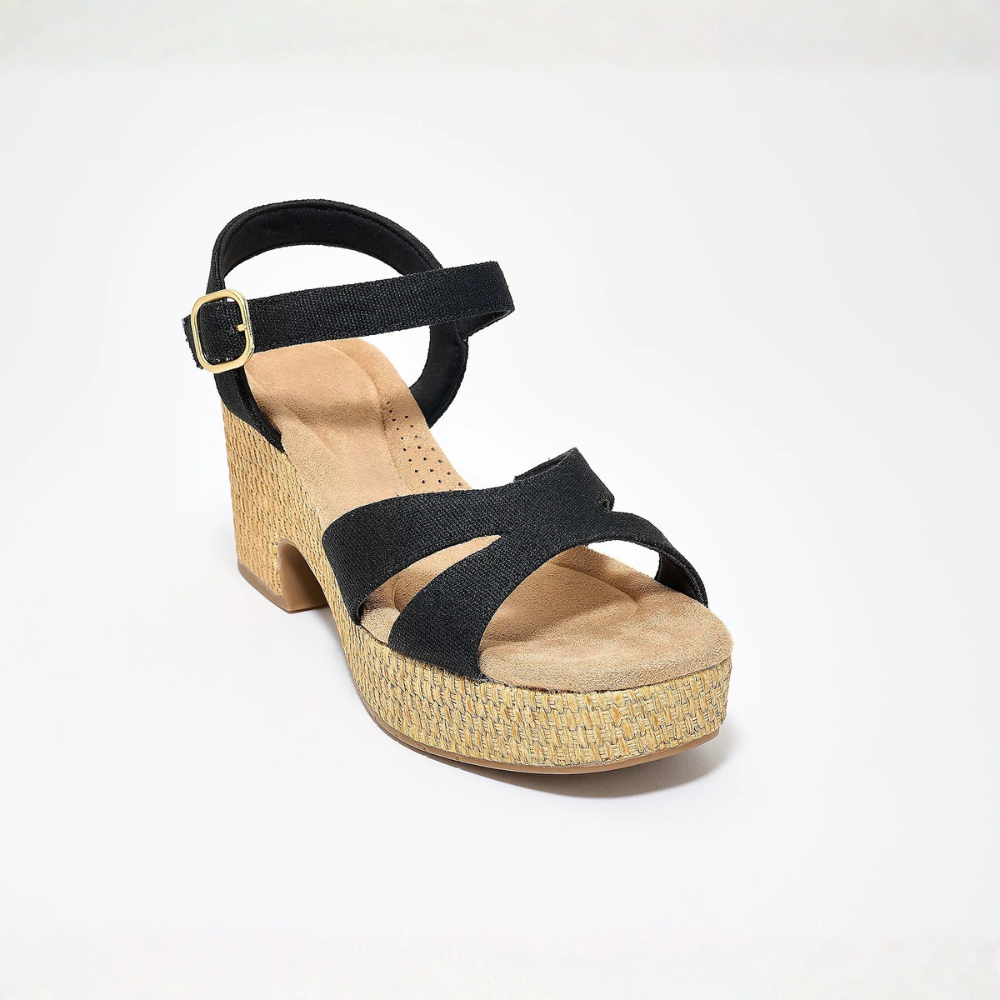 Profilo laterale di sandali da donna con zeppa, scarpe estive eleganti e comode, un'ottima scelta di calzature.