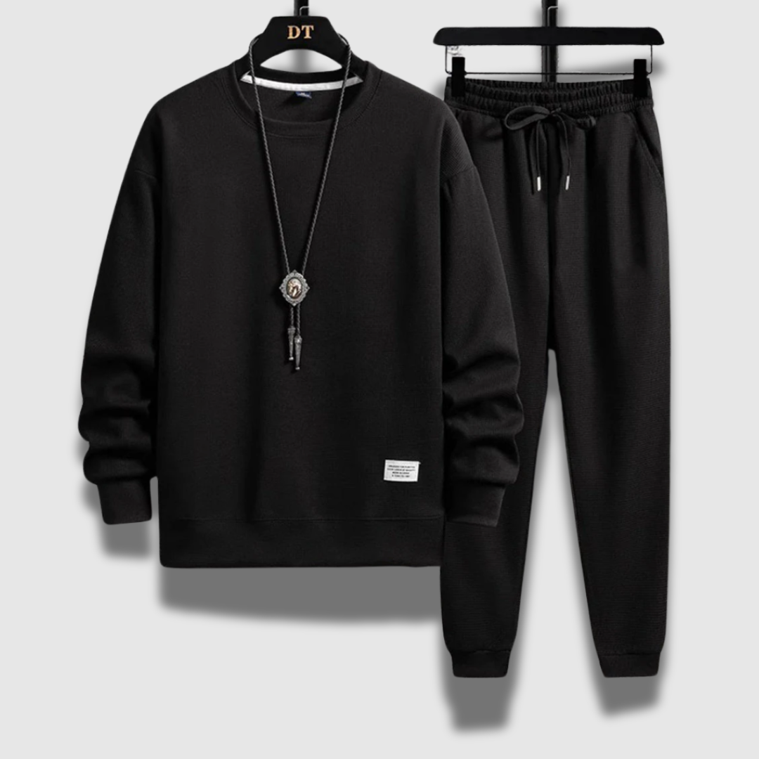Stiloso set jogging uomo: completo due pezzi premium, design moderno per sport e tempo libero.
