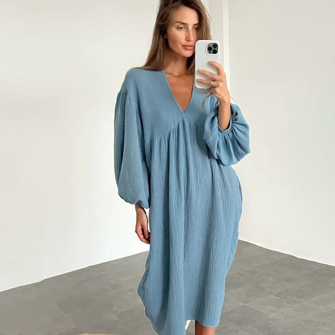 Abito midi casual donna, scollo a V e vestibilità comoda. Perfetto per primavera estate, eleganza e comfort.