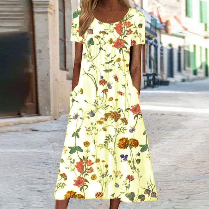 Elegante abito lungo donna floreale, senza maniche con taglio svasato. Comodo e fresco per la stagione estiva.