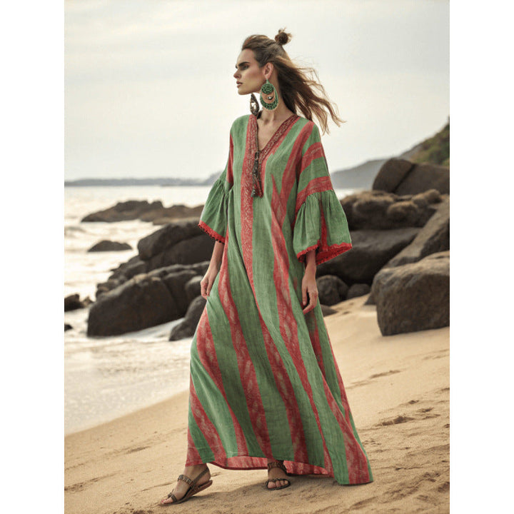 Abito donna lungo estivo, stile bohémien con design fluido e stampe tropicali.