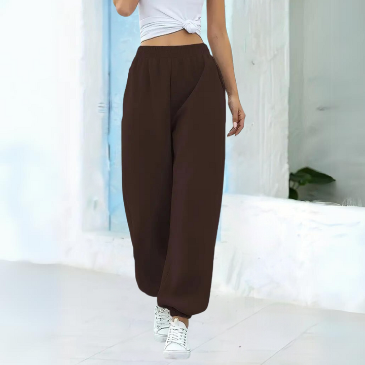 Joggers donna casual chic a vita alta, design largo per un outfit moderno e confortevole.