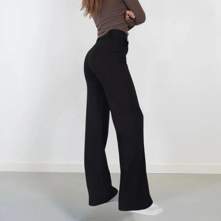 Abbigliamento femminile: pantaloni a gamba larga e vita alta per un look versatile, moderno ed elegante.