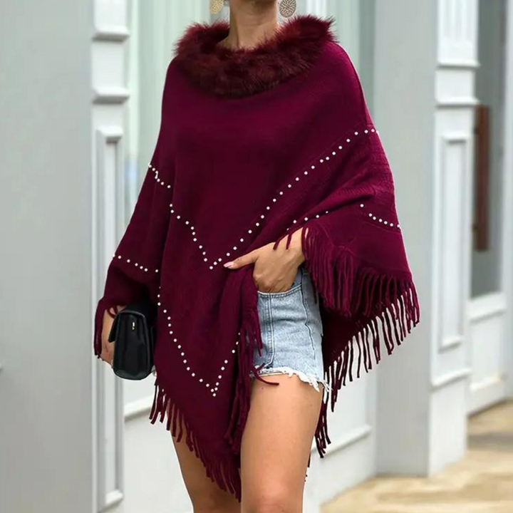 Elegante poncho donna rosso con dettagli raffinati, un tocco di moda per ogni occasione. Stile unico.