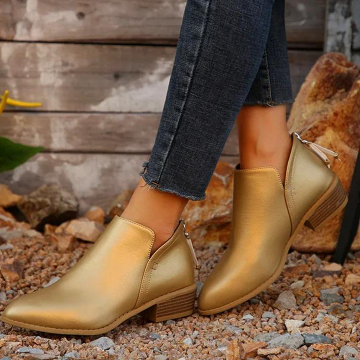 Stivaletto oro donna brillante, elegante e comodo. Aggiungi un tocco glamour al tuo look autunnale con queste scarpe.