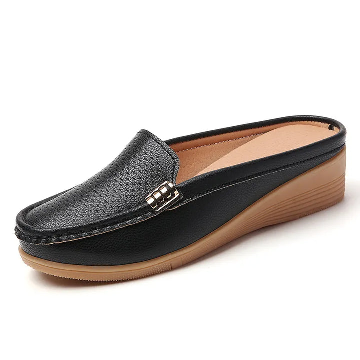 Mocassini mule donna anatomici per comfort quotidiano, zeppa morbida, stile casual ed elegante.