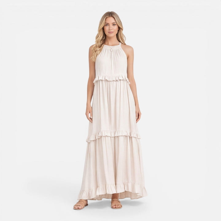 Abito maxi donna estivo fluido a balze, senza maniche, perfetto per vacanze chic e look casual.