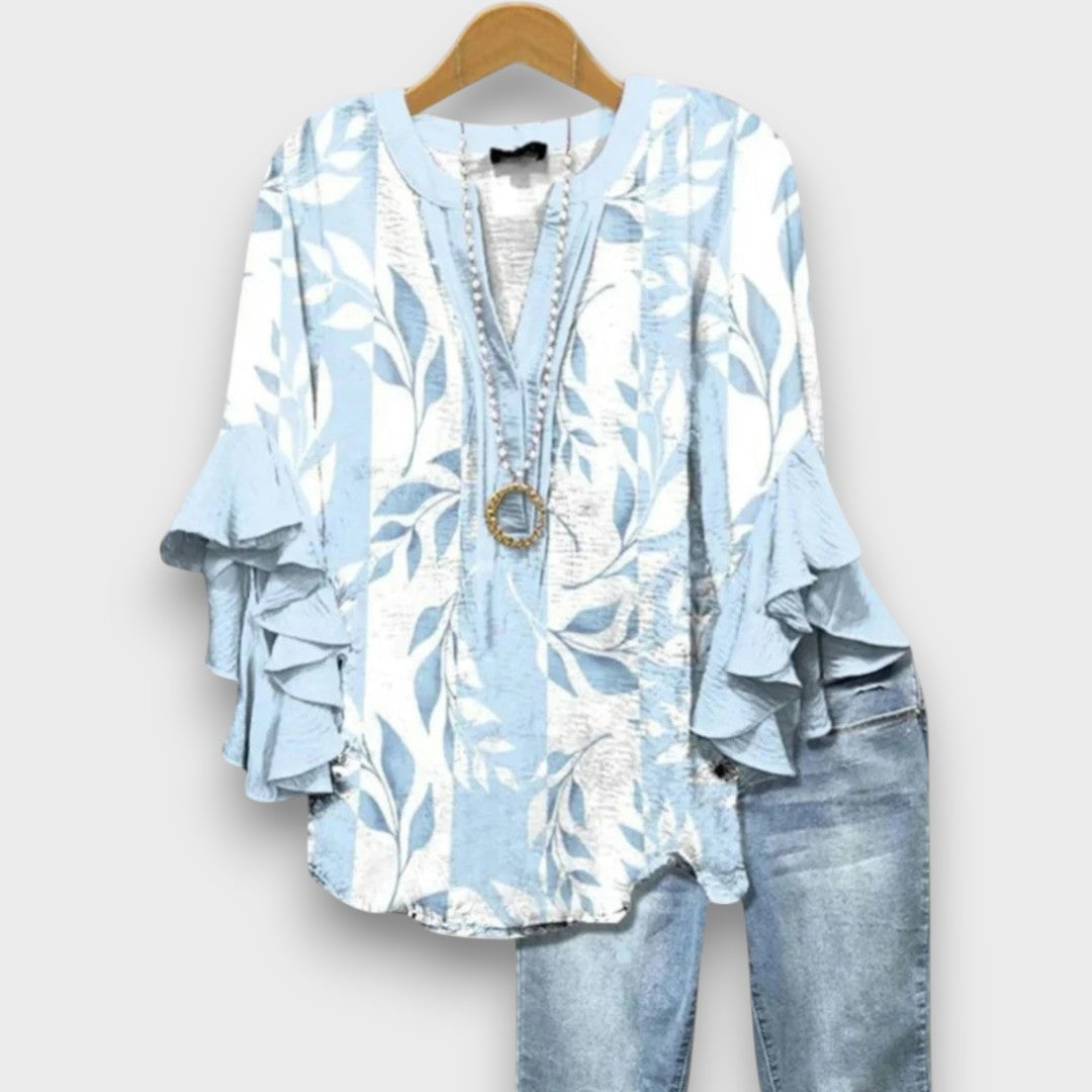 Camicetta floreale da donna con volant, scollo a V e lacci. Ideale per moda primavera ed estiva.