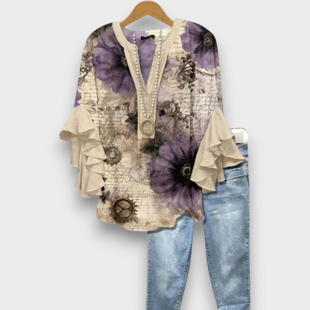 Camicetta floreale da donna con delicati volant, scollo a V e lacci. Top elegante per primavera/estate.