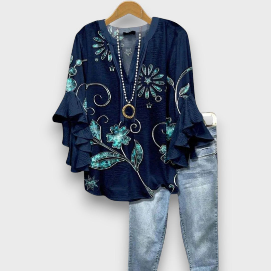 Camicetta donna elegante con volant, scollo a V e lacci. Perfetta per outfit primaverili ed estivi.