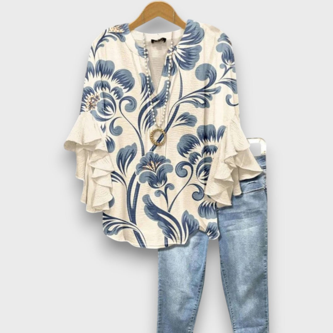 Camicetta donna elegante a volant con scollo a V e lacci. Look boho chic perfetto per primavera/estate.