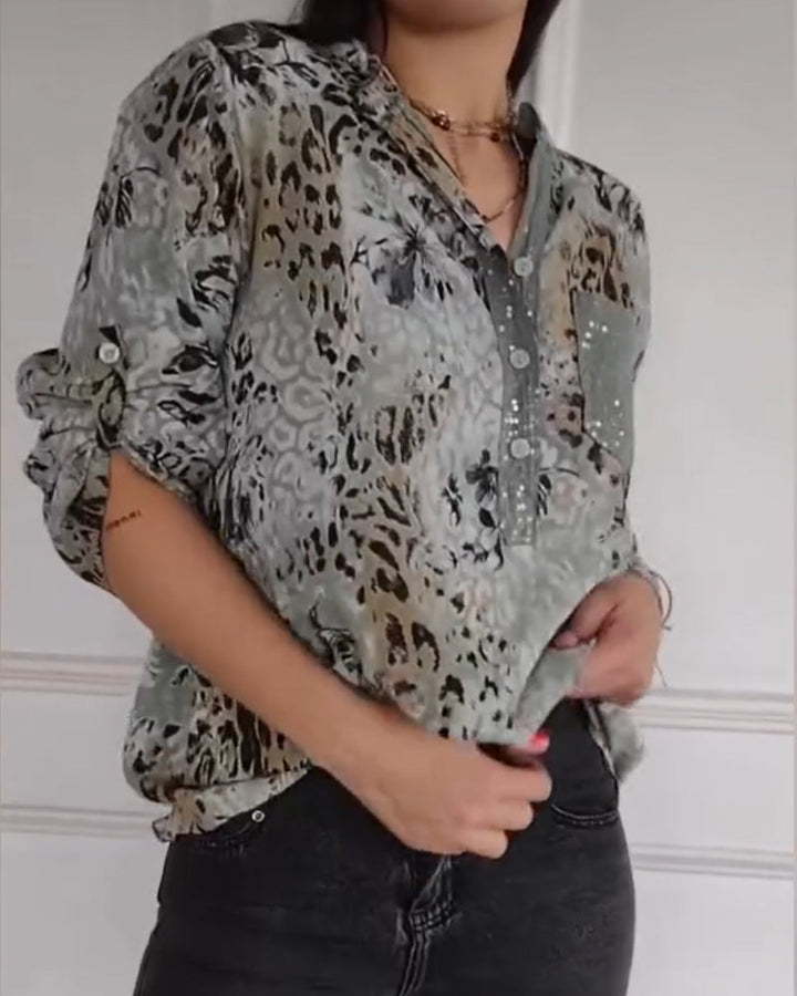 Camicetta donna primavera/estate, stile elegante. Stampa animalier floreale, maniche tre quarti e dettagli paillettes.
