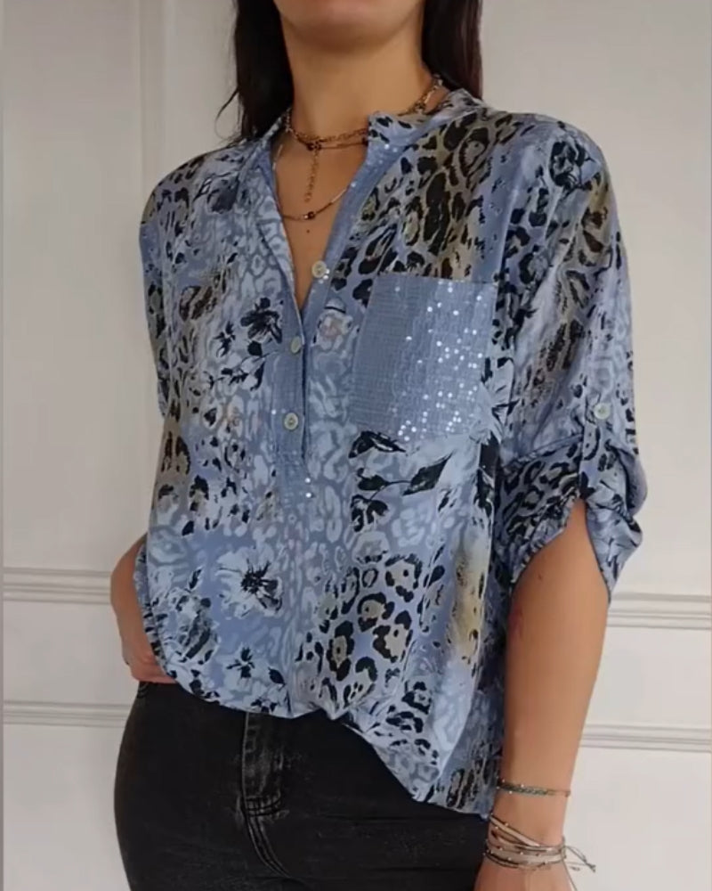 Camicetta donna elegante con stampa animalier floreale e paillettes. Perfetta per look casual chic primavera/estate.