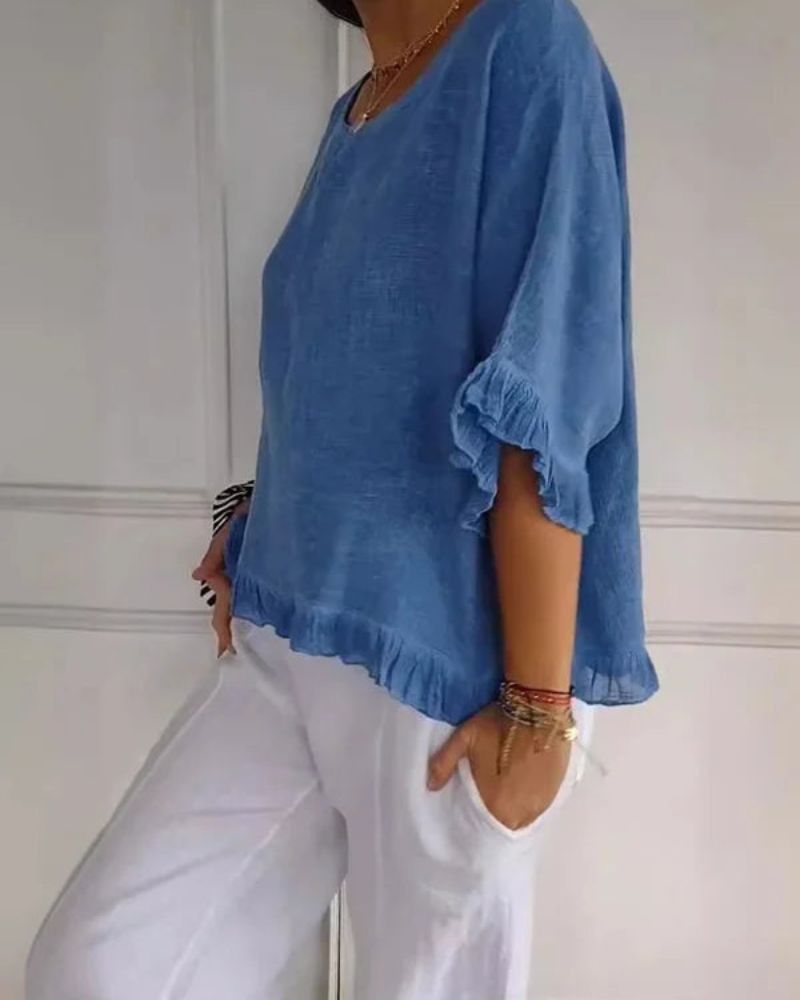 Blusa casual donna blu con volant sulle maniche, scollo rotondo, stile comodo ed elegante.