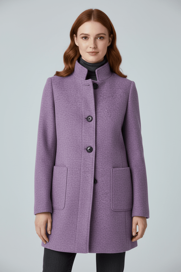 Caldo cappotto lungo donna in misto lana, per un comfort elegante nelle giornate fredde.